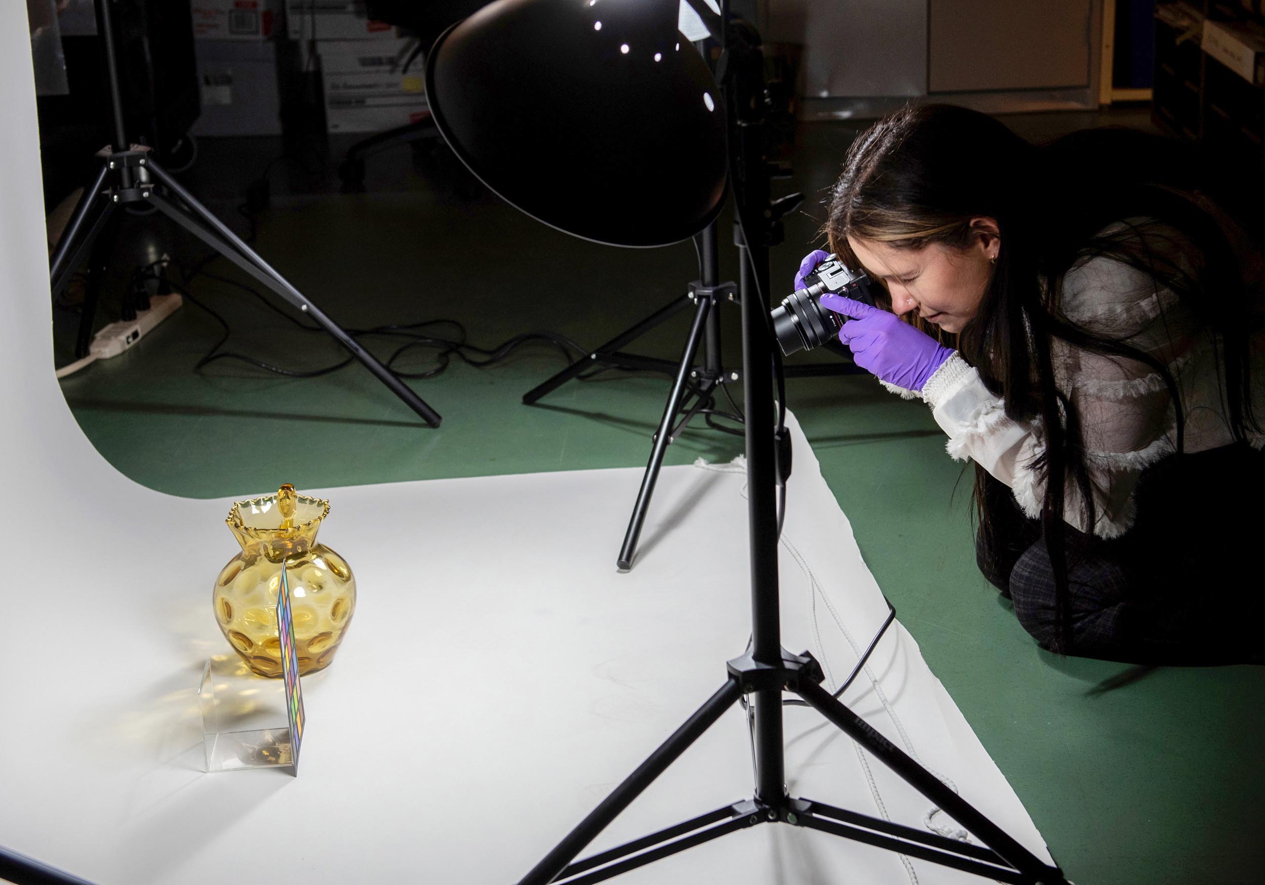 Student taking photo of artefact